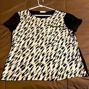 Calvin Kline short sleeve blouse with leather pocket detail.